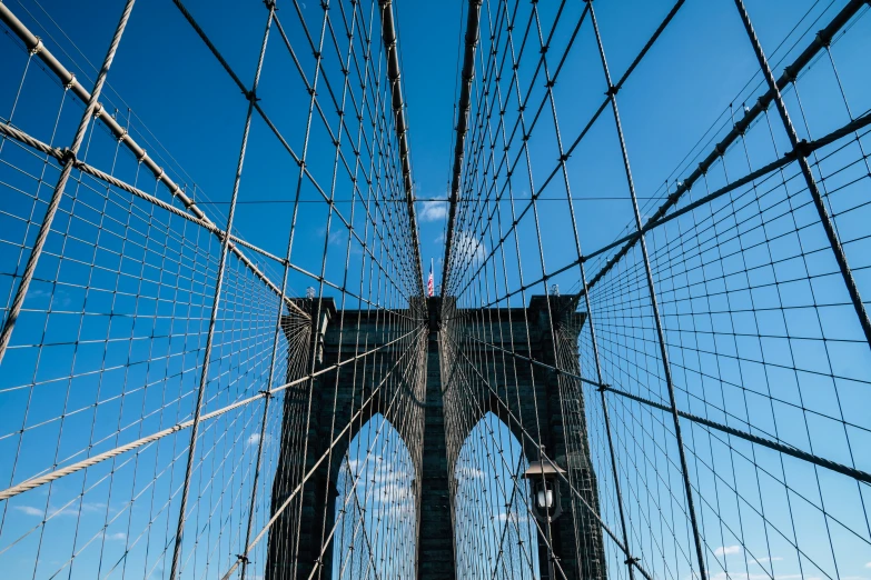 view from below the brooklyn bridge as seen by boat