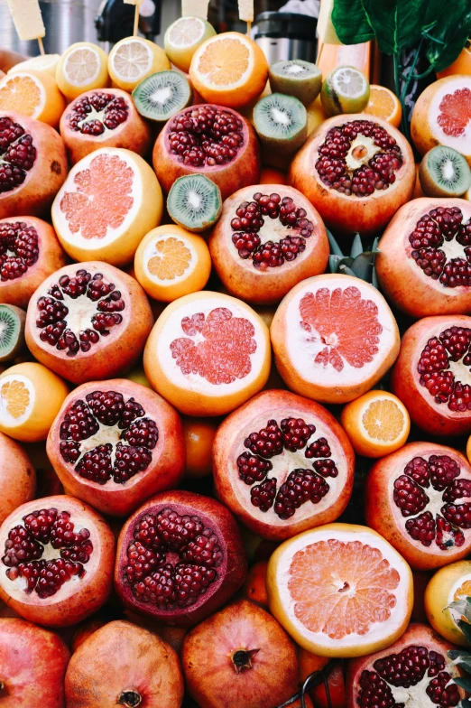 there is a very close picture of some citrus fruits