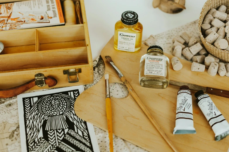 a wooden box filled with lots of small jars of liquid