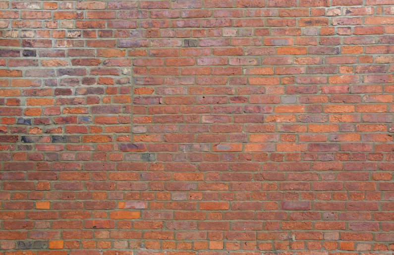 the wall is made of old red bricks