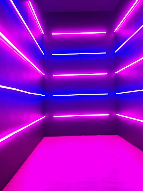 a dark room with pink and red neon lights