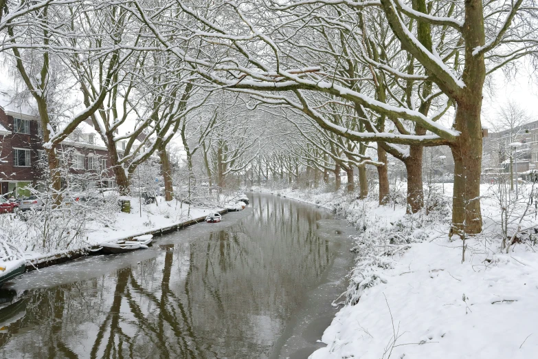 a snowy river running through a snow covered countryside