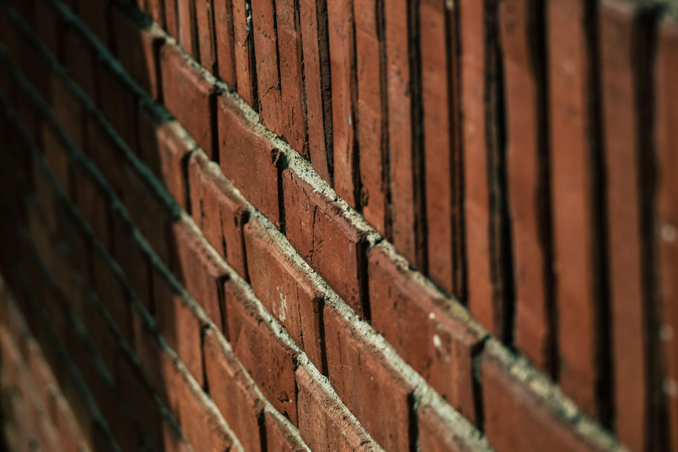 the corner of a brick building made from old bricks