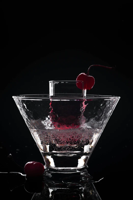 the fruits and berries are splashing out of the martini glass