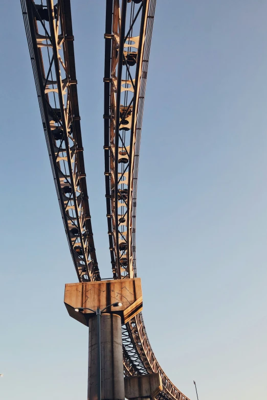 a very tall metal bridge structure with metal support bars