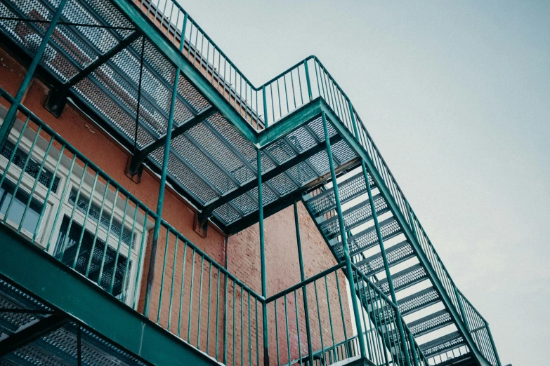 metal stairways and balconies against an orange wall