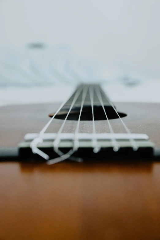 an electric guitar's strings lying on top of a table