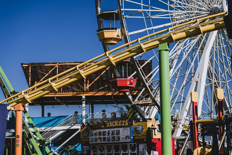 ferris wheel in front of other rides in the park