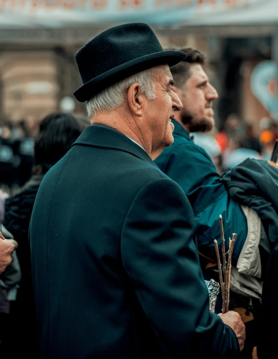 people in hats and coats are standing next to each other