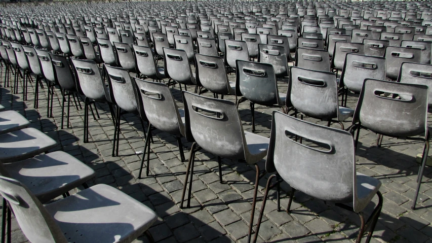rows of old grey chairs are lined up