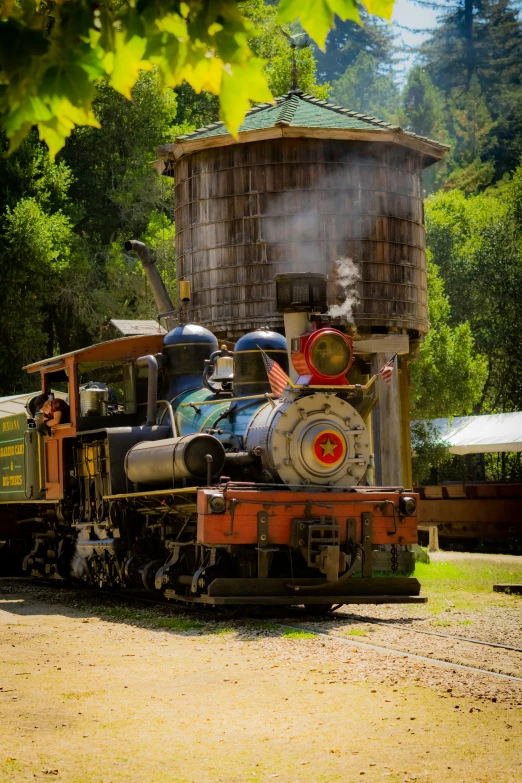 an old fashioned train on a railroad tracks