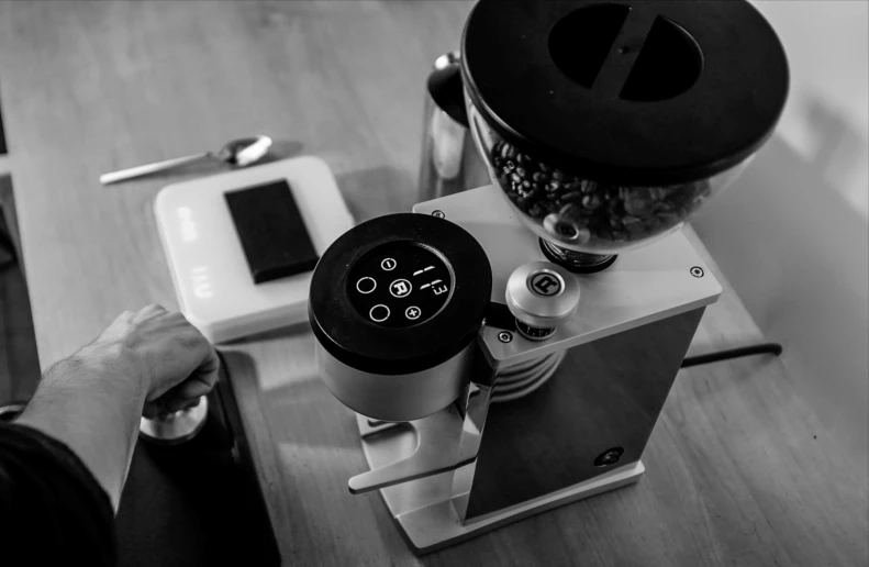 a person is preparing a snack with a grinder