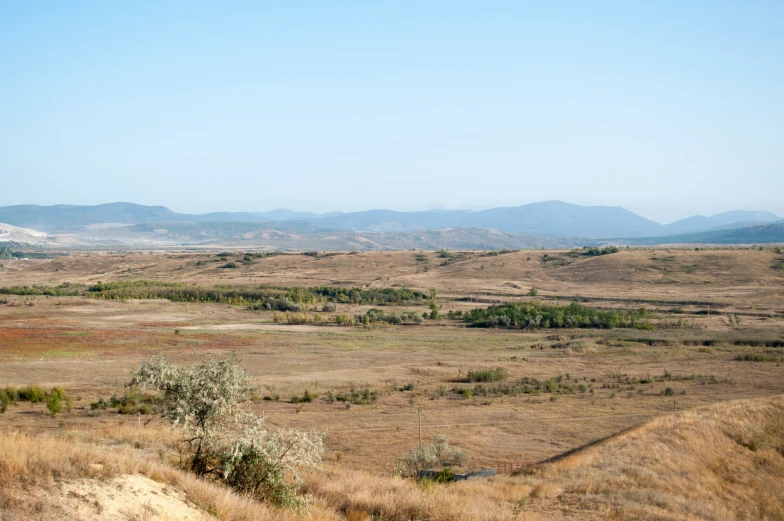 a po taken from a hill looking over a plain