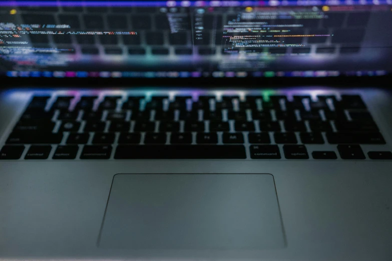 a close up image of the backlit keyboard on a laptop computer