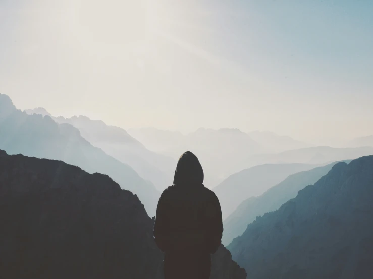 a person standing on top of a mountain