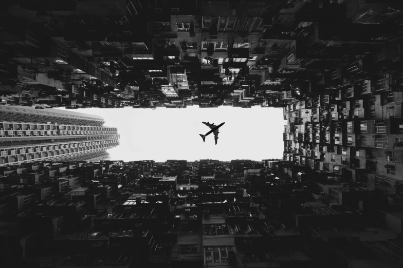 a black and white po with a plane flying in the sky