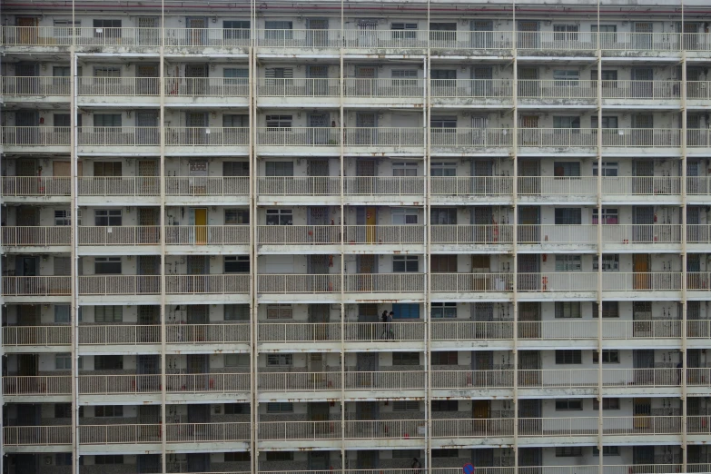 many windows are made of balconies on the side of a building