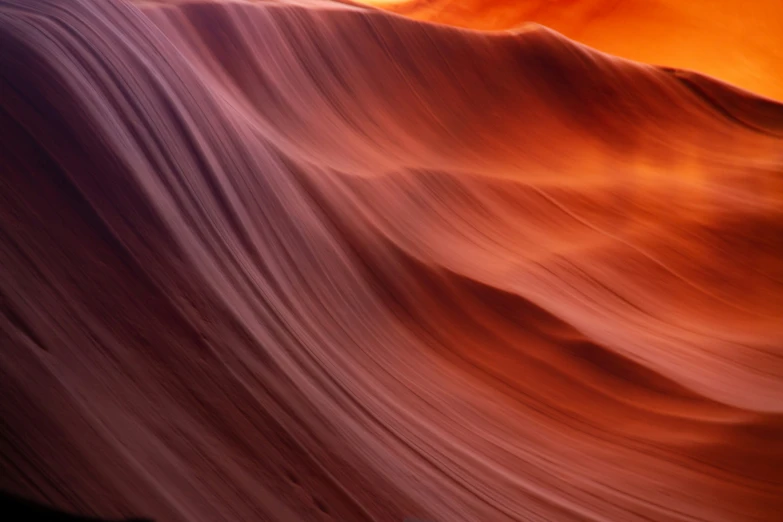 a hillside with a sunset seen over it