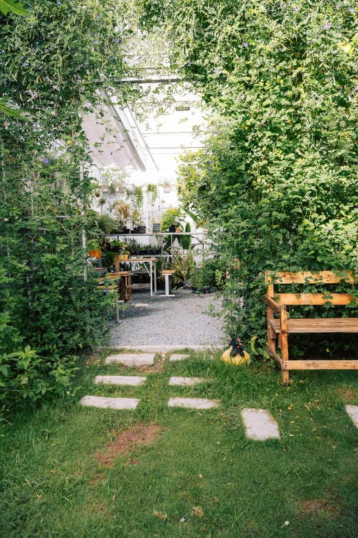an area with stepping stones and a patio and garden