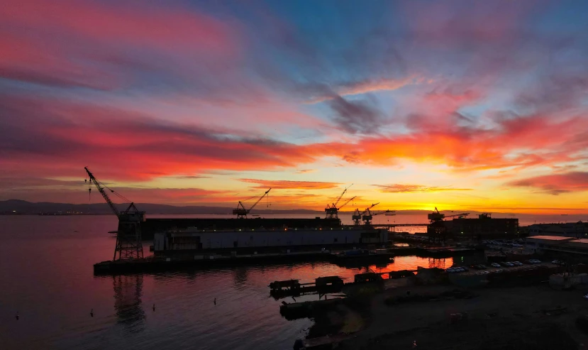 a view of the sunset over some docks