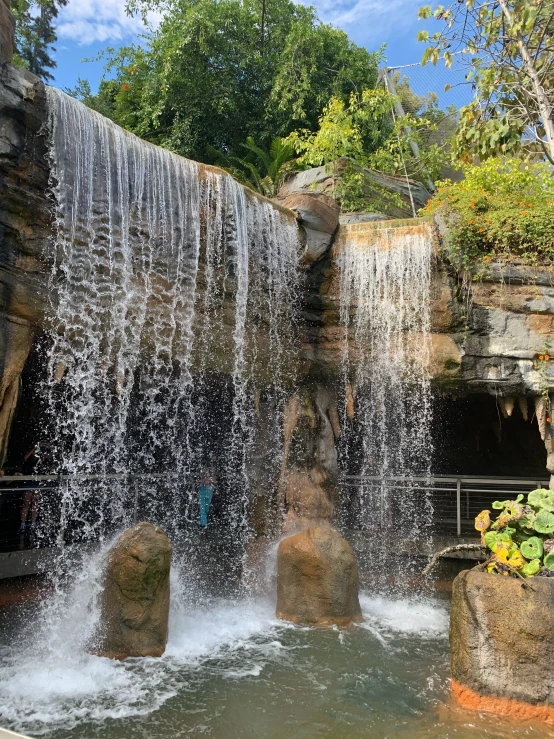 water falling off a waterfall into a river