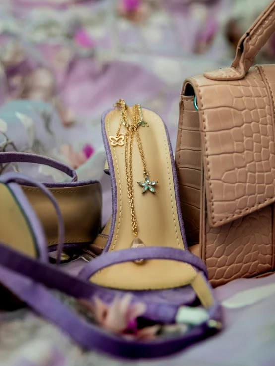 handbags and shoes sitting on the ground