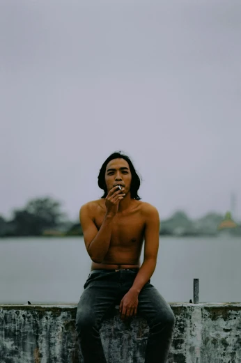 a man with  smoking a cigarette