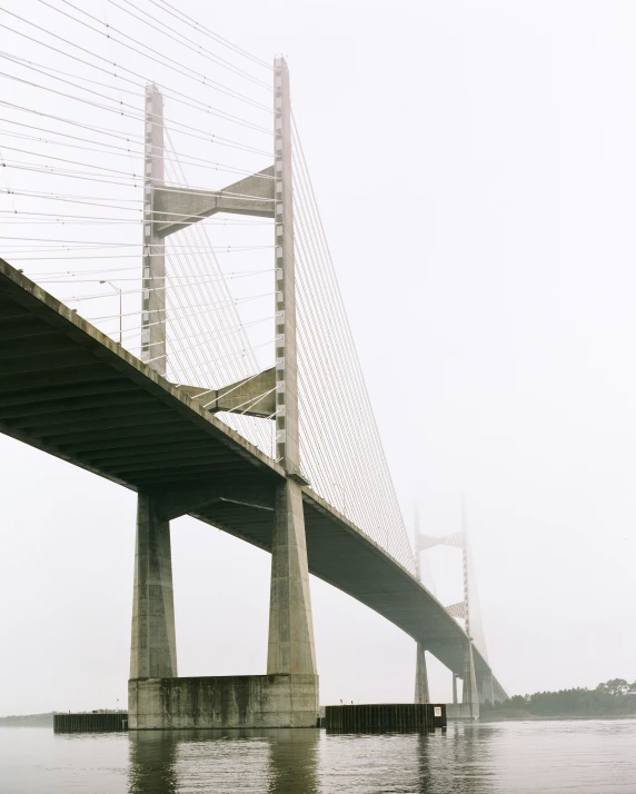 a view of a large bridge from the water