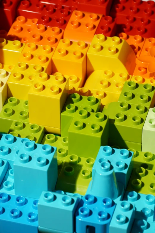 a group of blocks and bricks with many colors