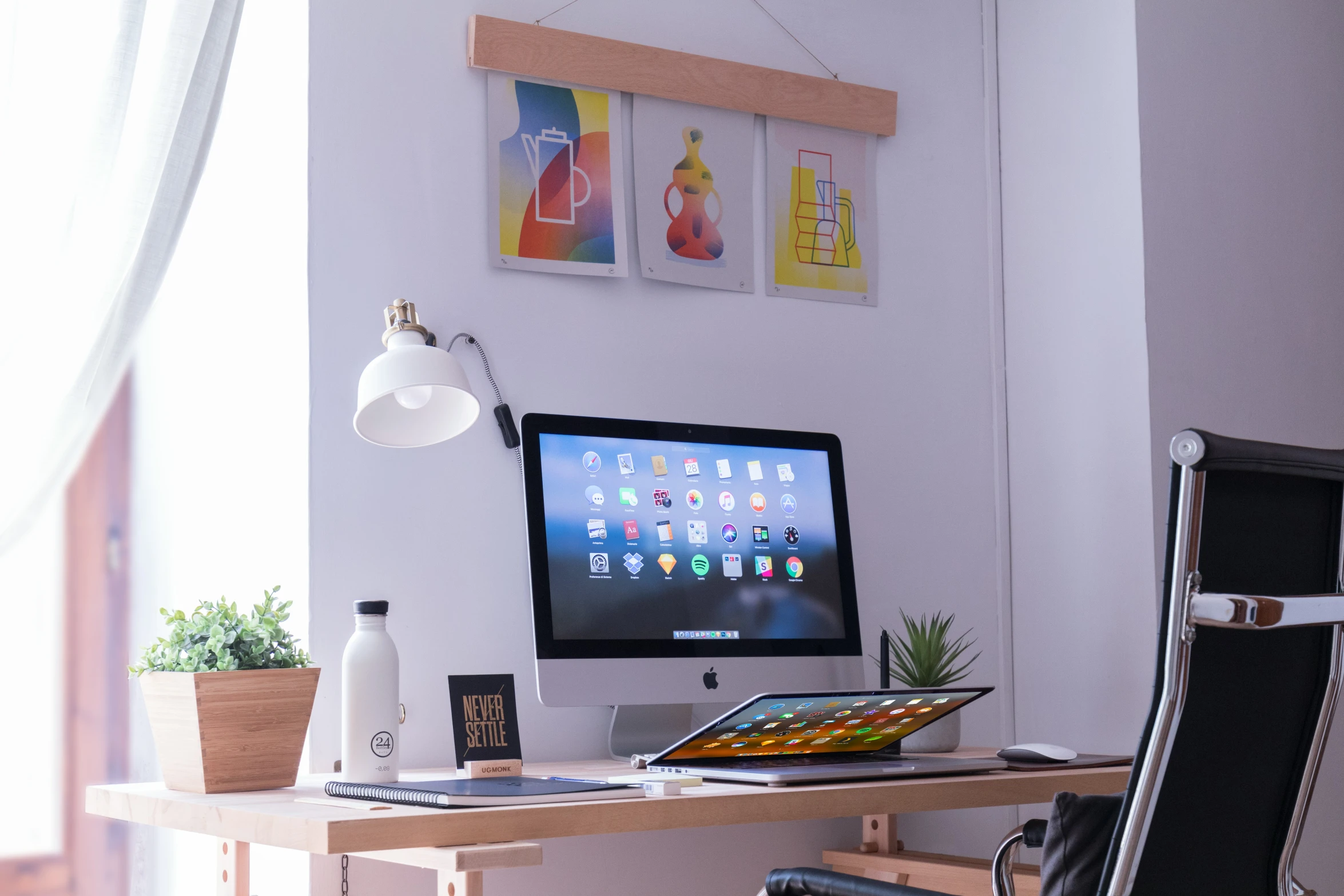 a desk in a room with a computer on it