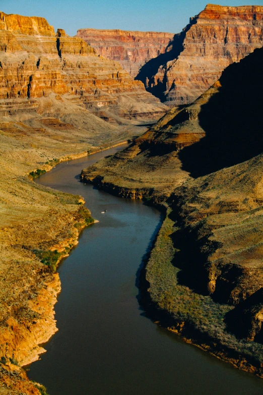 the view of a large river in a mountainous area