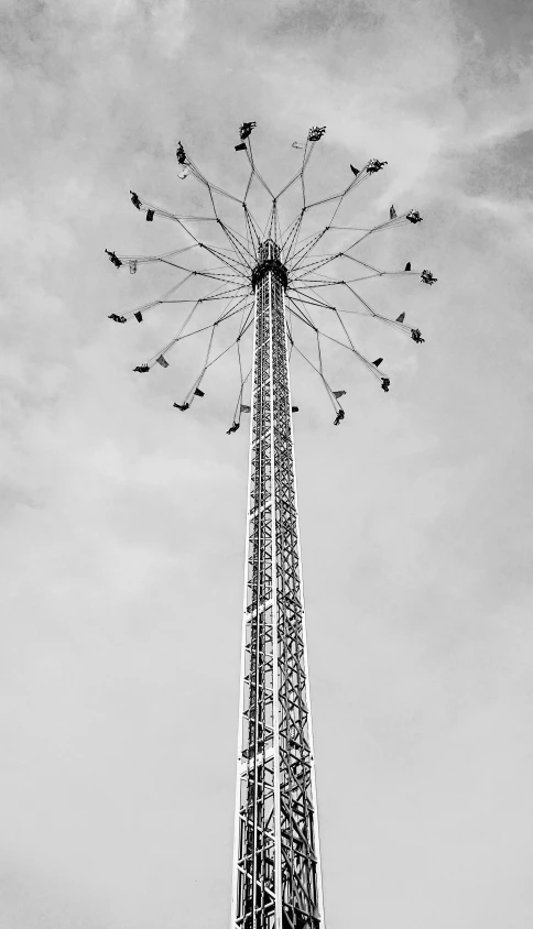 a large tower that is against a cloudy sky