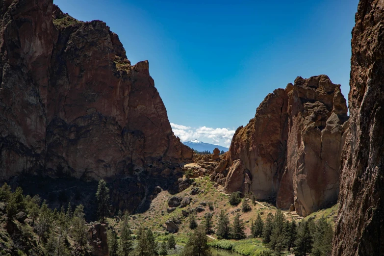 a view of the mountains from inside a cliff