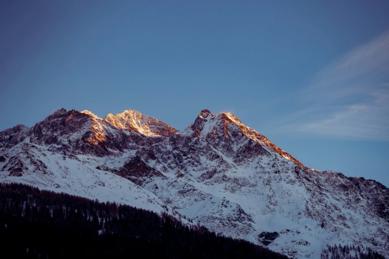 there are many mountains and a tree on this land