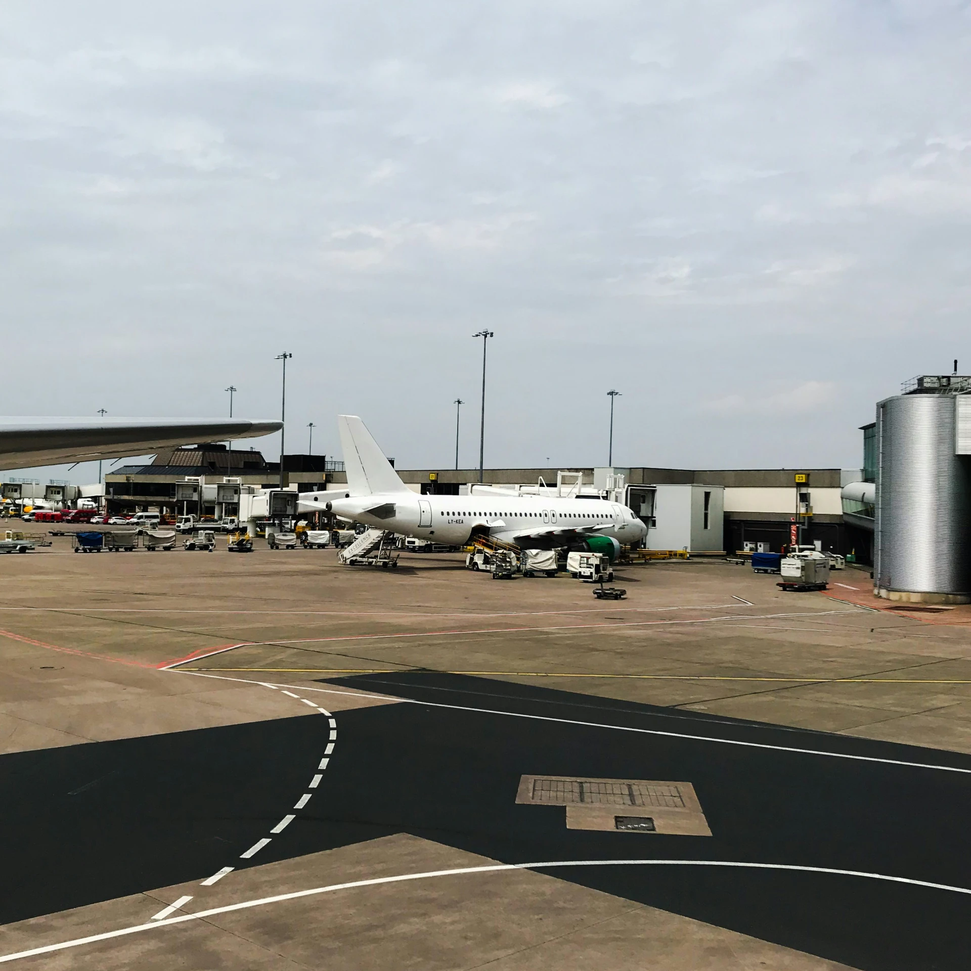 several airplanes are parked at the gate of an airport