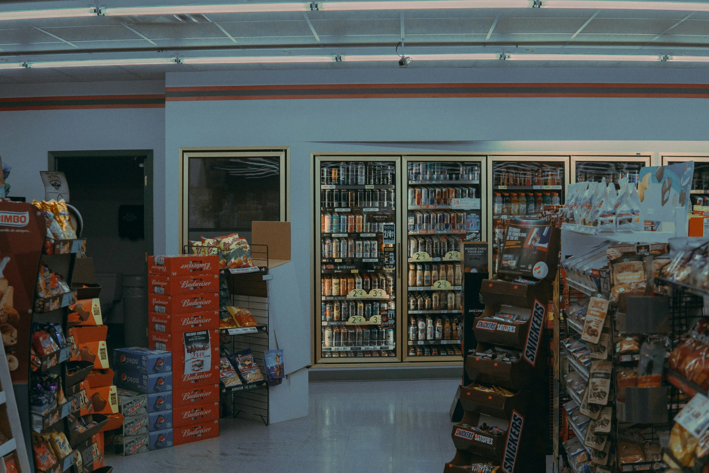 shelves and bins with various items are stocked