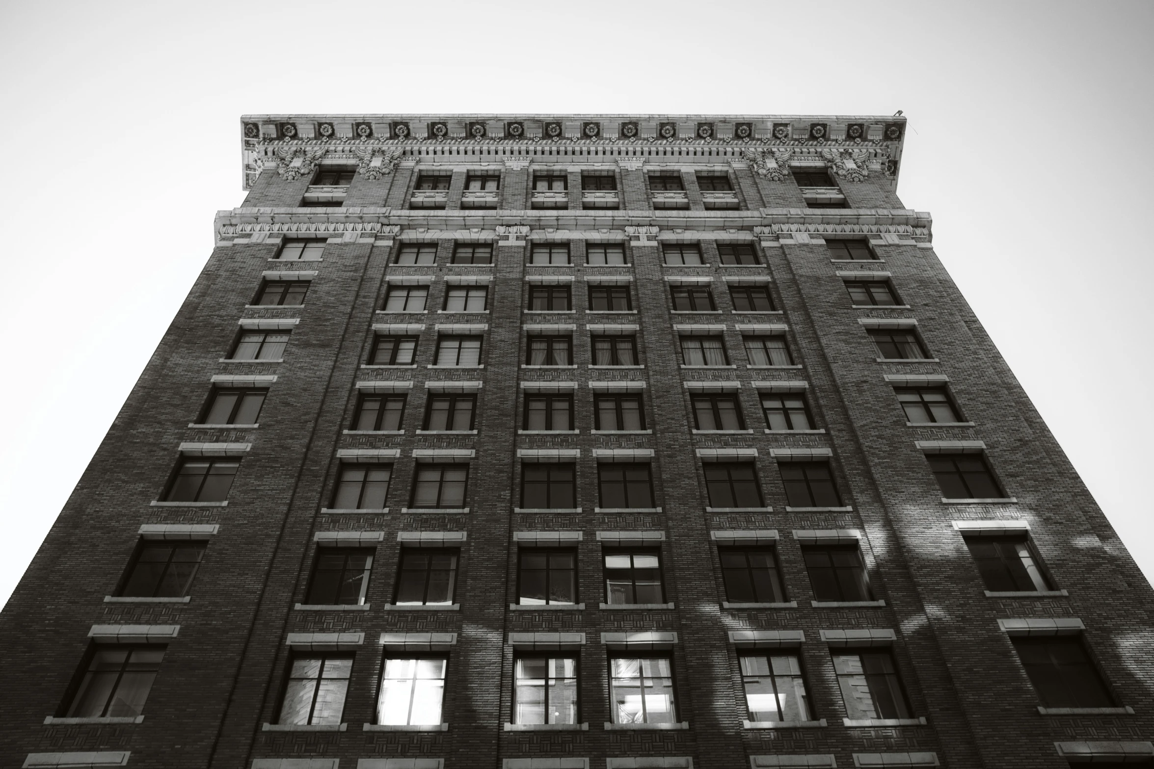 a tall building with windows on a sunny day