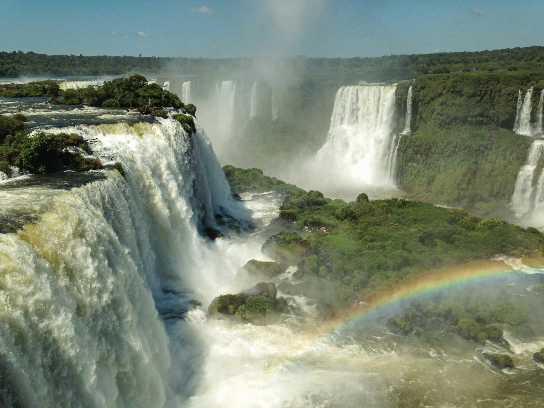 water guss out as it sits at the edge of a waterfall