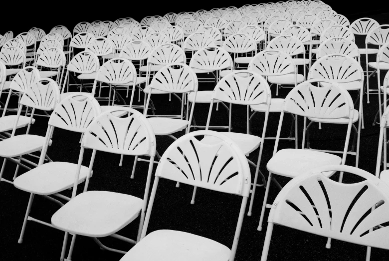 the chairs have been placed together in a black and white po