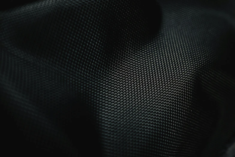 a black textured surface showing very small bumps