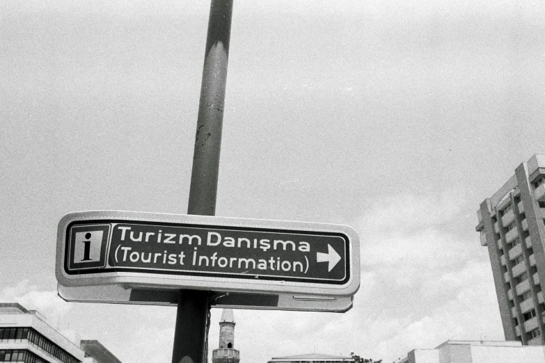 an information sign on a street corner in a city