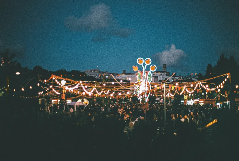 a crowd watches at an amut park