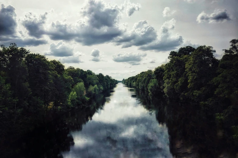 a beautiful wide river and a cloudy sky