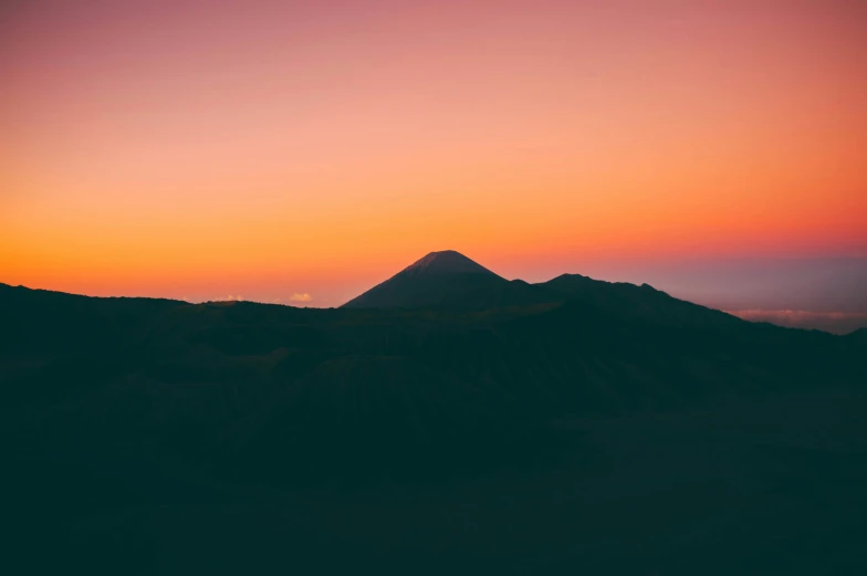 some mountains with trees in the background