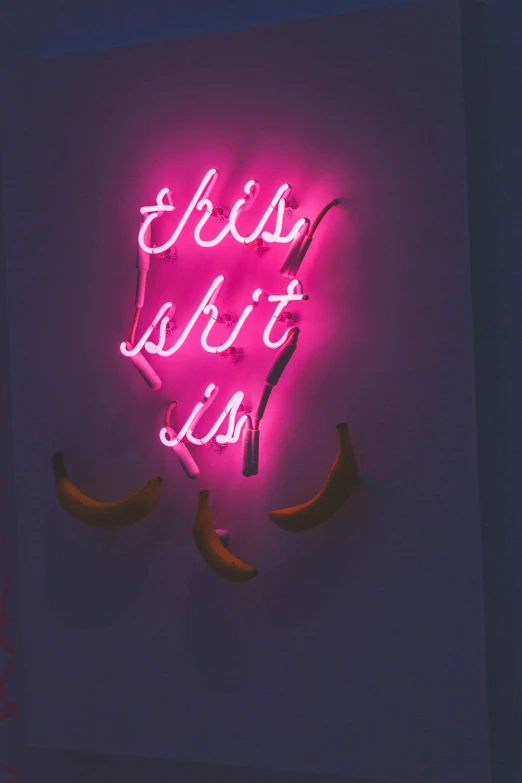 a neon sign sitting in the corner of a room