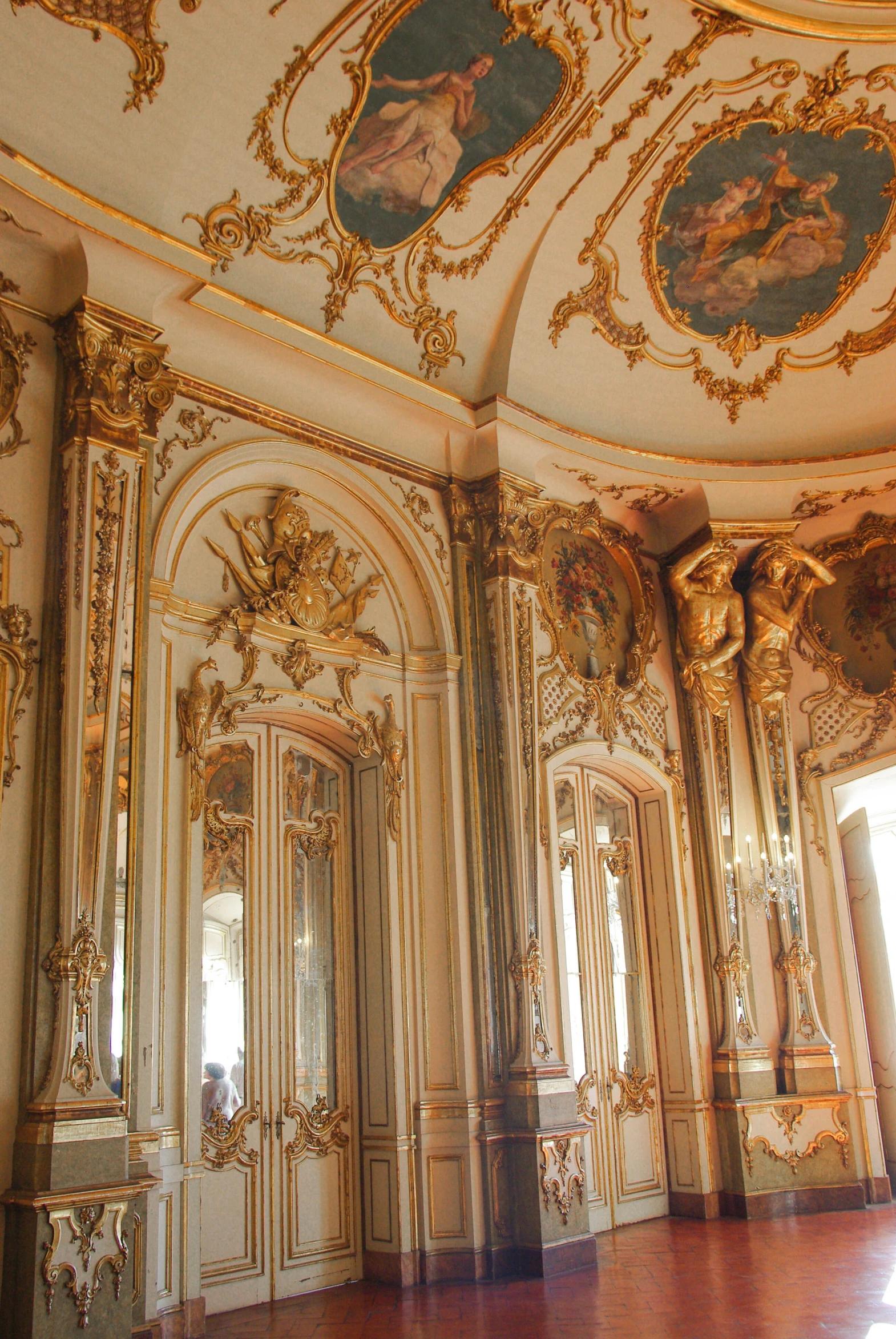 an elaborate painted room with gold trim and walls