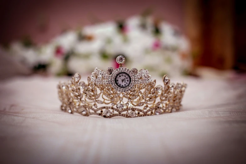 a tiara on top of a white cloth