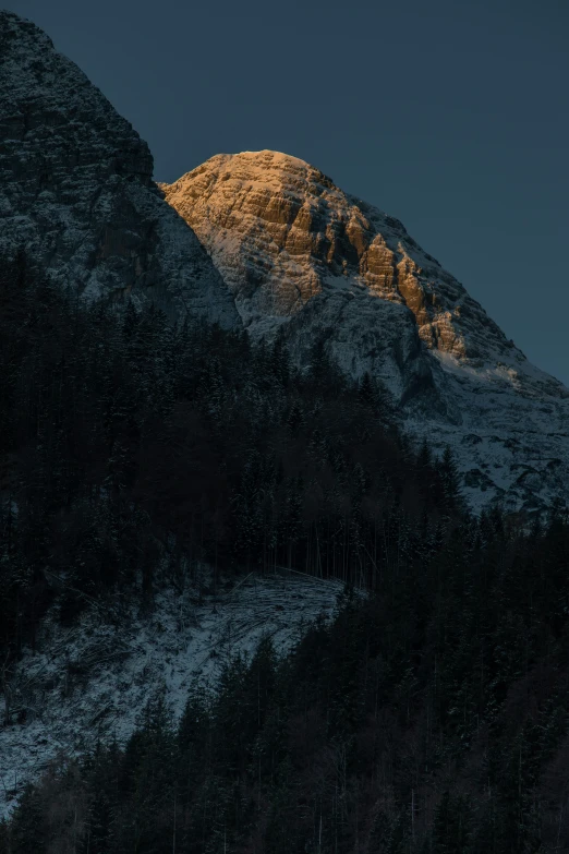 the mountains are covered in snow with no trees