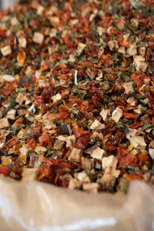 a wooden table topped with lots of dry chopped food