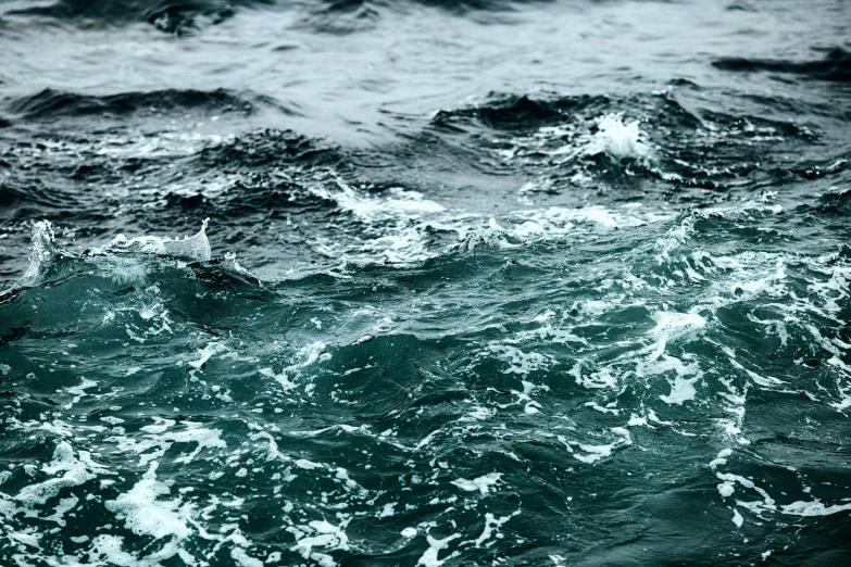 a close up of a wave with only the top part visible